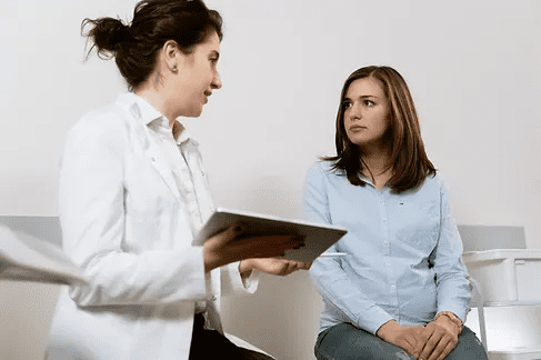 94891female-consulting-with-doctor-1.png
